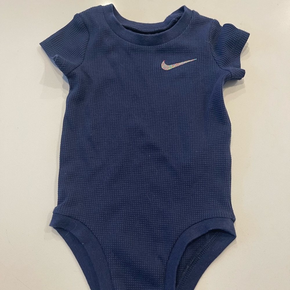 12 month never worn Nike onsie